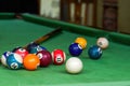 Billiards and pool cues on the pool table