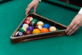 Billiards pool frame with balls in the hands Royalty Free Stock Photo