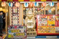 Billiken at Shinsekai, Osaka. The famous Billiken statue outside the store. Billiken is a charm doll and popular symbol of happin