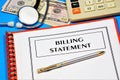 Billing statement. Text inscription in the form on the medical folder with documents. Royalty Free Stock Photo