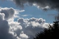 Billowing grey white clouds with blue sky. Stormy weather. Royalty Free Stock Photo