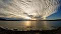 Billowy Clouds over Lake with Golden Light