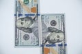 $100 bills  close-up against a white background. Wealth and finance concept. Royalty Free Stock Photo