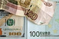 Bills of 100 dollars and 100 euros and a crumpled bill of 100 rubles close-up. Royalty Free Stock Photo