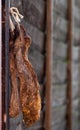 Biltong - dry cured meat on a wooden fence