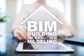 BIM - Building information modeling concept on virtual screen.