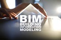 BIM - Building information modeling concept on virtual screen. Royalty Free Stock Photo