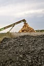 Bin of coal and stack scrap lumber