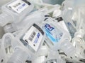 Bin filled with small Purell hand sanitizer bottles, perfect for attaching to bags