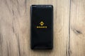 Binance mobile app running at smartphone screen. Binance one of the world`s leading cryptocurrency exchange and trading platform Royalty Free Stock Photo