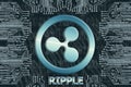 Binary code and circuit board on a dark background.  ripple XRP cryptocurrency symbol. Concept of digital currency, Blockchain, Royalty Free Stock Photo