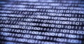 Binary code on computer screen. Shallow depth of field. Royalty Free Stock Photo