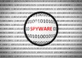 Binary code with SPYWARE and magnifying lens Royalty Free Stock Photo
