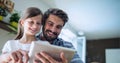Binary coding data processing against caucasian father and daughter using digital tablet at home Royalty Free Stock Photo
