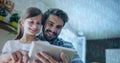 Binary coding data processing against caucasian father and daughter using digital tablet at home Royalty Free Stock Photo