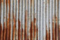 Metallic metal steel tin fence wall sheet  damaged by red brown rust zinc. Concept of wallpaper texture and background Royalty Free Stock Photo