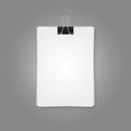 Binder clip bind stack of white paper sheets. Royalty Free Stock Photo