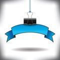 A binder clip suspends this banner Royalty Free Stock Photo