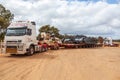 BINDOON, AUSTRALIA - Oct 13, 2012: Oversize loads of mining machinery are transported by truck to the iron ore mines in the