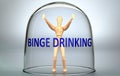 Binge drinking can separate a person from the world and lock in an isolation that limits - pictured as a human figure locked