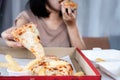 Binge eating disorder concept with woman over eating fast food pizza Royalty Free Stock Photo