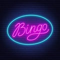 Bingo neon sign on brick wall background.