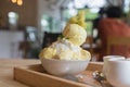 Bingsoo or Bingsu Korea dessert durian served with sweetened condensed milk topping with cotton candy