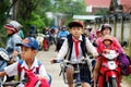 Vietnamese pupil ride bicycle from school