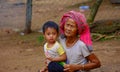 Portrait of a grandmother and grandson at a poverty village.