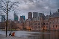 Binnenhof castle (Dutch Parliament) with the Hofvijver lake against a background of skyscrapers