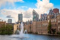 Binnenhof palace complex with pond and fountain in the foreground and business district in the background, The Hague, Netherlands Royalty Free Stock Photo