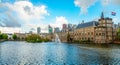 Binnenhof palace complex with pond and fountain in the foreground and business district in the background, The Hague, Netherlands Royalty Free Stock Photo