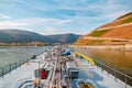 Binnenvaart, Translation Inlandshipping on the river rhein in Germany during sunset hours, Gas tanker vessel rhine river Royalty Free Stock Photo