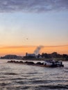 Binnenvaart, Translation Inlandshipping on the river Rhein Lobith Netherlands September 2021, during sunset hours