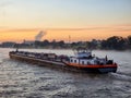 Binnenvaart, Translation Inlandshipping on the river Rhein Lobith Netherlands September 2021, during sunset hours