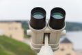 Binocular against observation deck view closeup, tourism Royalty Free Stock Photo