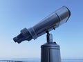 Binocular isolated on the blue sky watching on the sea Royalty Free Stock Photo