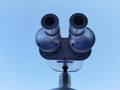 Binocular isolated on the blue sky watching on the sea Royalty Free Stock Photo