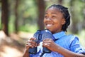 Binocular, search or happy boy child in forest hiking, sightseeing or discovery. Lens, equipment or excited African kid Royalty Free Stock Photo