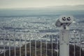 Binocular or telescope locate on Mount Moiwa for support traveler use looking for view of Sapporo City.