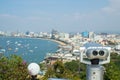 Binocular or telescope locate on viewpoint for support traveler use looking for view of Pattaya city. Royalty Free Stock Photo