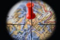 Binocular view of Kabul, Afghanistan globe map atlas geography landmark with red push pin thumbtack marker in macro closeup of Mid