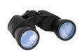 Binoculars with blue sky reflected on lenses Royalty Free Stock Photo