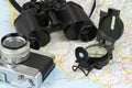 Binoculars, compass, camera and map Royalty Free Stock Photo