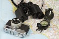Binoculars, compass, camera and map Royalty Free Stock Photo