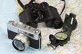 Binoculars, compass, camera and map Royalty Free Stock Photo