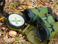 Binoculars and compass close up Royalty Free Stock Photo