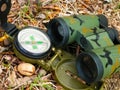 Binoculars and compass close up