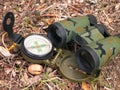 Binoculars and compass close up Royalty Free Stock Photo