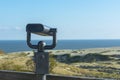 Binoculars in an iron case for sea tourists on the shore. Coin-operated binocular viewer Royalty Free Stock Photo